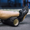 Roller fitness do masażu ciała, średnio twardy, wałek z wypustkami, czarny